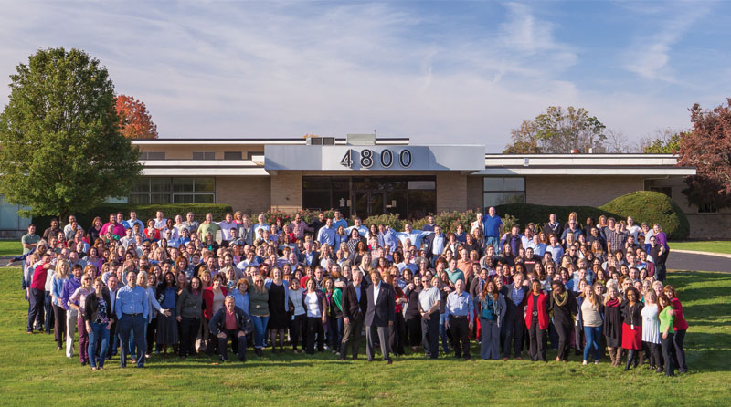 ASI group employee photo on lawn